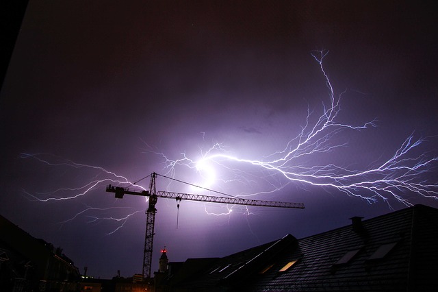 A crane struck by lightning in a thunderstorm